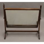 An Edwardian mahogany dressing table mirror. 68.5 cm wide.