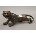 A bronze model of a tiger. 30.5 cm long.