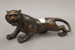 A bronze model of a tiger. 30.5 cm long.