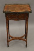 An 18th/19th century French ormolu mounted side table. 43 cm wide.