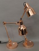 A pair of copper adjustable lamps. 55 cm high.