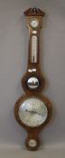 A 19th century mahogany banjo barometer. 96.5 cm high.