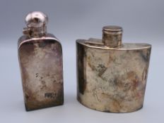 A silver hip flask (4.6 troy ounces) and a plated hip flask. The former 10 cm high.