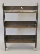 An early 20th century oak bookcase. 56.5 cm wide, 86 cm high, 14 cm deep.