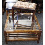 A modern glass topped coffee table and a stool. The former 86 cm wide.