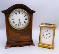 An Edwardian mahogany mantle clock and a carriage clock. The former 20 cm high.