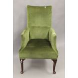 A late 19th century green upholstered armchair. 69 cm wide.
