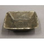 A Chinese small square white metal dish. 7.5 cm wide.