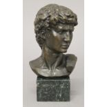 A bronze male bust. 17 cm high.