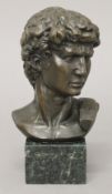 A bronze male bust. 17 cm high.