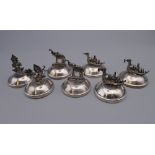 Seven Siamese sterling silver menu holders. The largest 3.5 cm high.