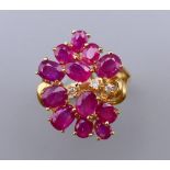 A 14 ct gold, diamond and ruby ring. Ring size N. 5.2 grammes total weight.