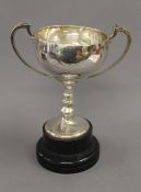 An engraved silver trophy cup on stand. 28 cm high overall. 13.6 troy ounces.