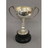 An engraved silver trophy cup on stand. 28 cm high overall. 13.6 troy ounces.