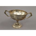 An engraved silver trophy cup. 13 cm high. 11.5 troy ounces.