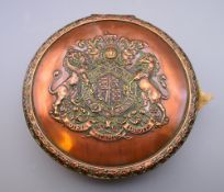 A Victorian copper seal box enclosing a wax seal (AF) and with velum indenture. 18 cm diameter.