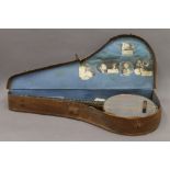 A cased banjo. The case 91.5 cm long.