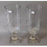 A pair of glass hurricane lamps. 40 cm high.