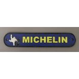 A cast iron 'Michelin' sign. 27 cm wide.