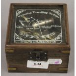A brass sextant in a box. The box 11 cm wide.