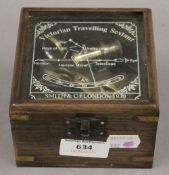 A brass sextant in a box. The box 11 cm wide.