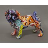 A graffiti decorated model of a pug dog.