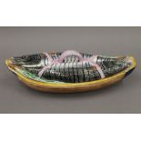 A late 19th century English Majolica 'mackerel lidded' boat shaped pate dish,