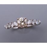 An 18 ct white gold nine stone diamond ring. Total diamond weight 1 carat. Ring size P. 2.