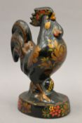 A decorative model of a cockerel. 25 cm high.