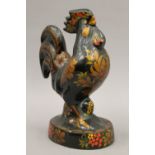 A decorative model of a cockerel. 25 cm high.