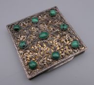 An 800 silver and malachite compact. 7.5 cm wide.