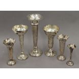 Six silver trumpet vases. The largest 28 cm high. 37.2 troy ounces weighted.