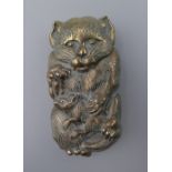 A vesta in the form of a cat. 7 cm high.