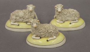 Three Staffordshire sheep. Each approximately 13 cm long.