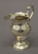 A silver cream jug. 11 cm high. 110 grammes.