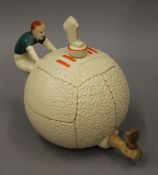 An early 20th century football form teapot. 17 cm high.