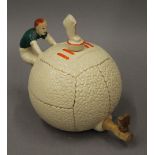 An early 20th century football form teapot. 17 cm high.