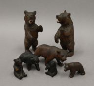 A collection of small carved Black Forest bears. The largest 13 cm high.