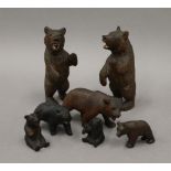 A collection of small carved Black Forest bears. The largest 13 cm high.
