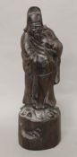 A Chinese carved rosewood figure. 30 cm high.