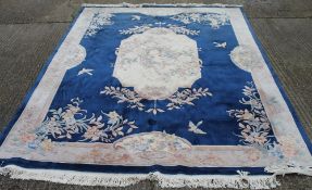 A large Chinese blue ground carpet. 366 x 276 cm.
