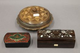 A mother-of-pearl inlaid rosewood box and two others. The former 14 cm wide.