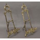 A pair of brass easels. 39.5 cm high.