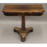 An early 19th century rosewood fold over card table. 91.5 cm wide.
