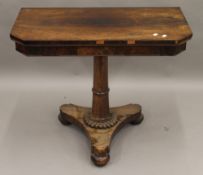 An early 19th century rosewood fold over card table. 91.5 cm wide.