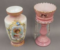 A Victorian pink glass lustre and a decorative glass vase. The former 35 cm high.