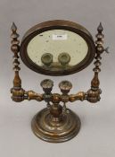 A Victorian turned wooden shaving mirror. 40 cm high.