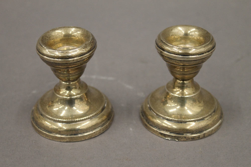 Two pairs of silver dwarf candlesticks. The largest 6.5 cm high. 11.2 troy ounces loaded. - Image 6 of 8