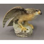 A Goldscheider Wien porcelain figure of a falcon. 32 cm high.
