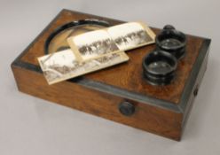 A Victorian Graphoscope stereoscopic viewer with cards. 36 cm long.